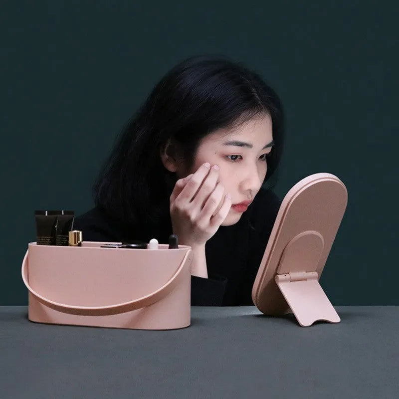 Pink portable makeup storage box with LED illuminated aluminium mirror and cosmetic compartments