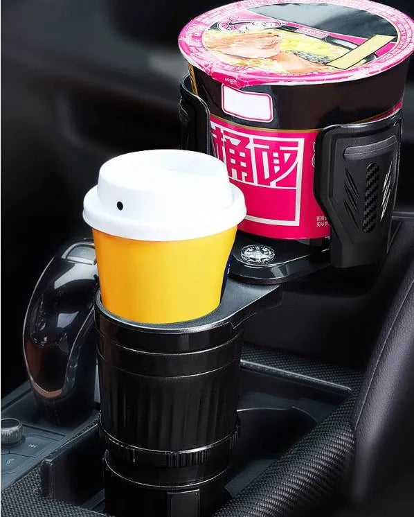 Retractable black car drink cup holder with adjustable base on a car console.