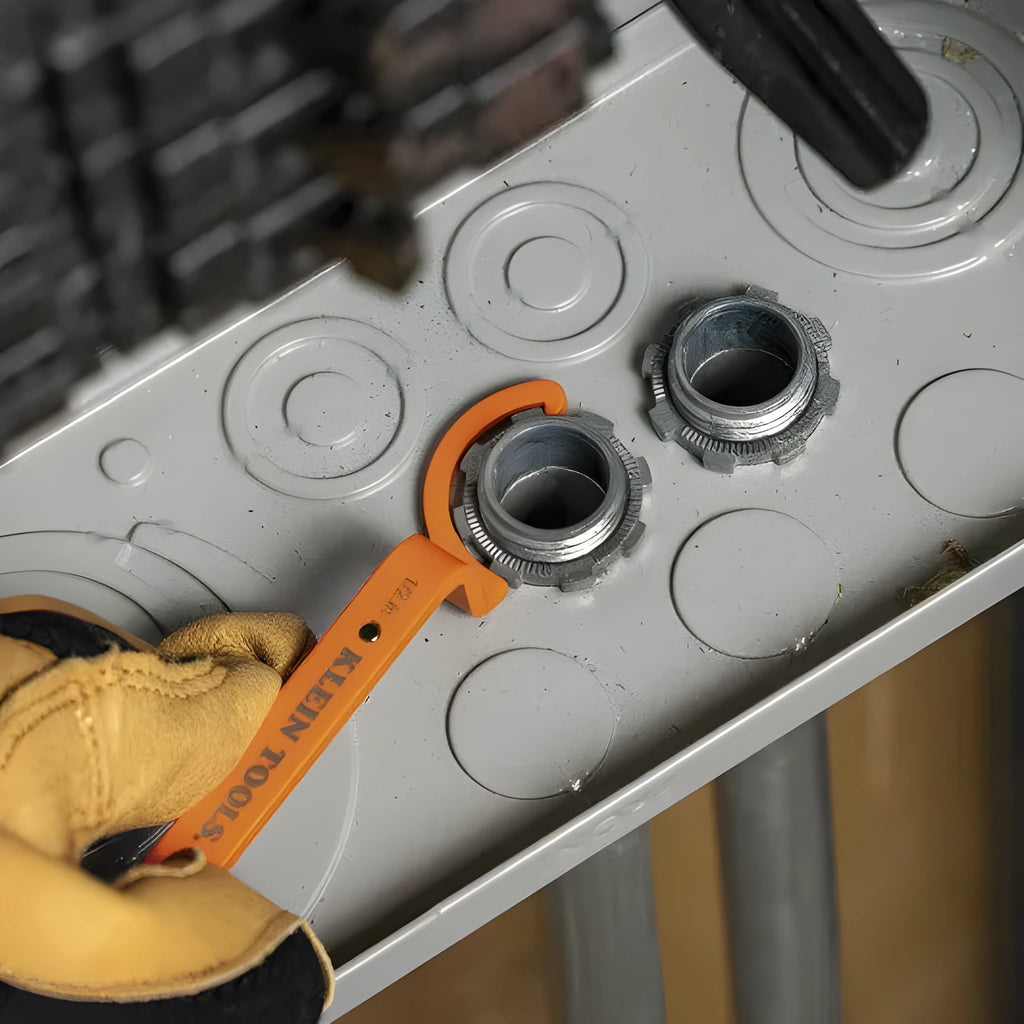 Crescent magnetic suction and catheter locking wrench three-piece set in orange, grey, and black colours