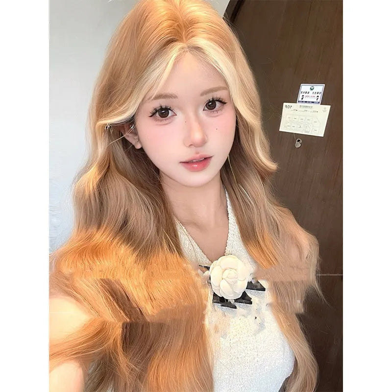 Long curly synthetic wig in American highlight gold colour with a natural one-word lace front.