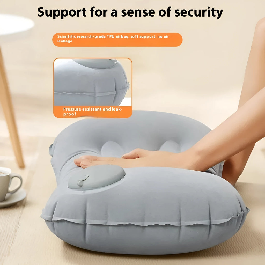 Grey inflatable travel pillow with soft flocking surface, shown deflated and inflated.