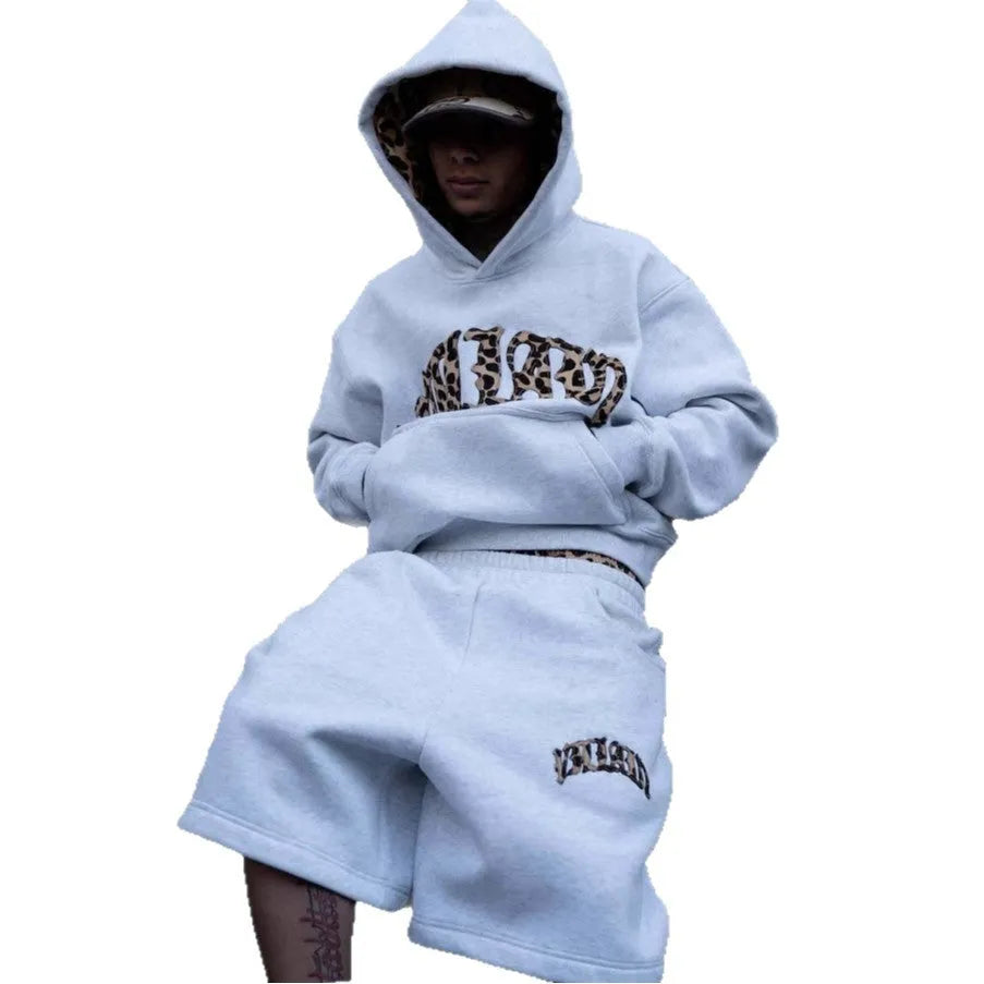 Man wearing grey patchwork double waist loose hip hop trousers for casual sports wear.