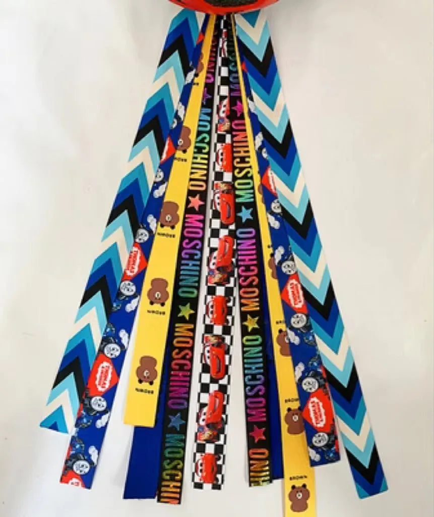 Children's helmet decorative streamer with elastic loop attachment in multiple colour options