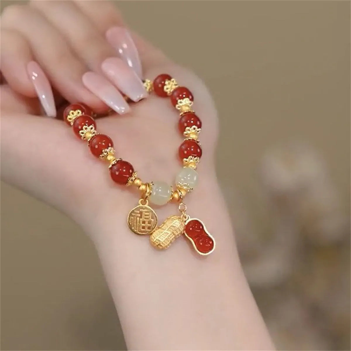Peace buckle bracelet with a coloured glass rabbit charm on a simple band