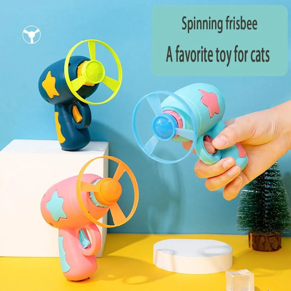 Blue interactive cat toy gun launching plastic frisbee for indoor feline play