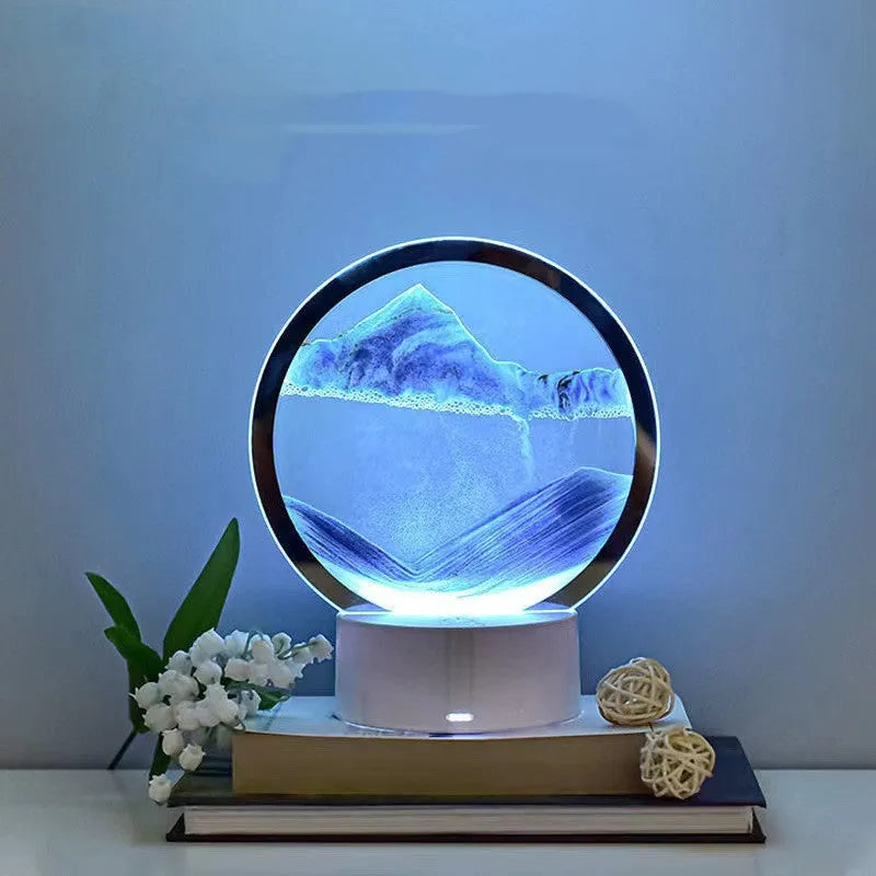 Creative 3D quicksand table lamp with glass shade and USB power cord on a nightstand.