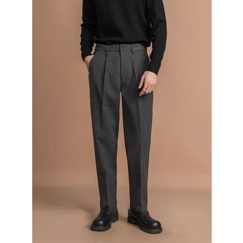 Men's straight-leg casual trousers in black with a draped design detail on the leg.