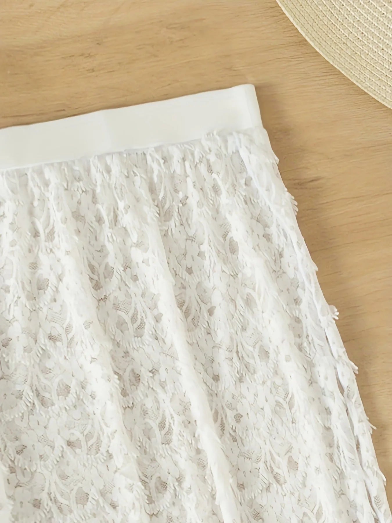 White three-piece swimsuit set with gathered long skirt, sleeveless top, and matching bottoms