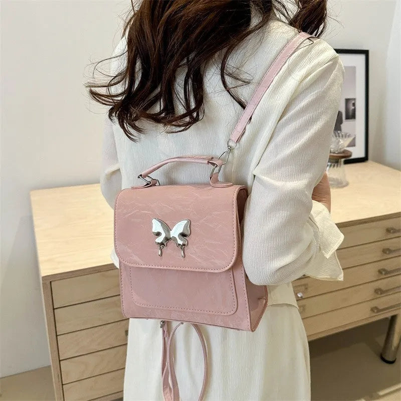Preppy style women's backpack handbag in PU leather with bow detailing and six colour options
