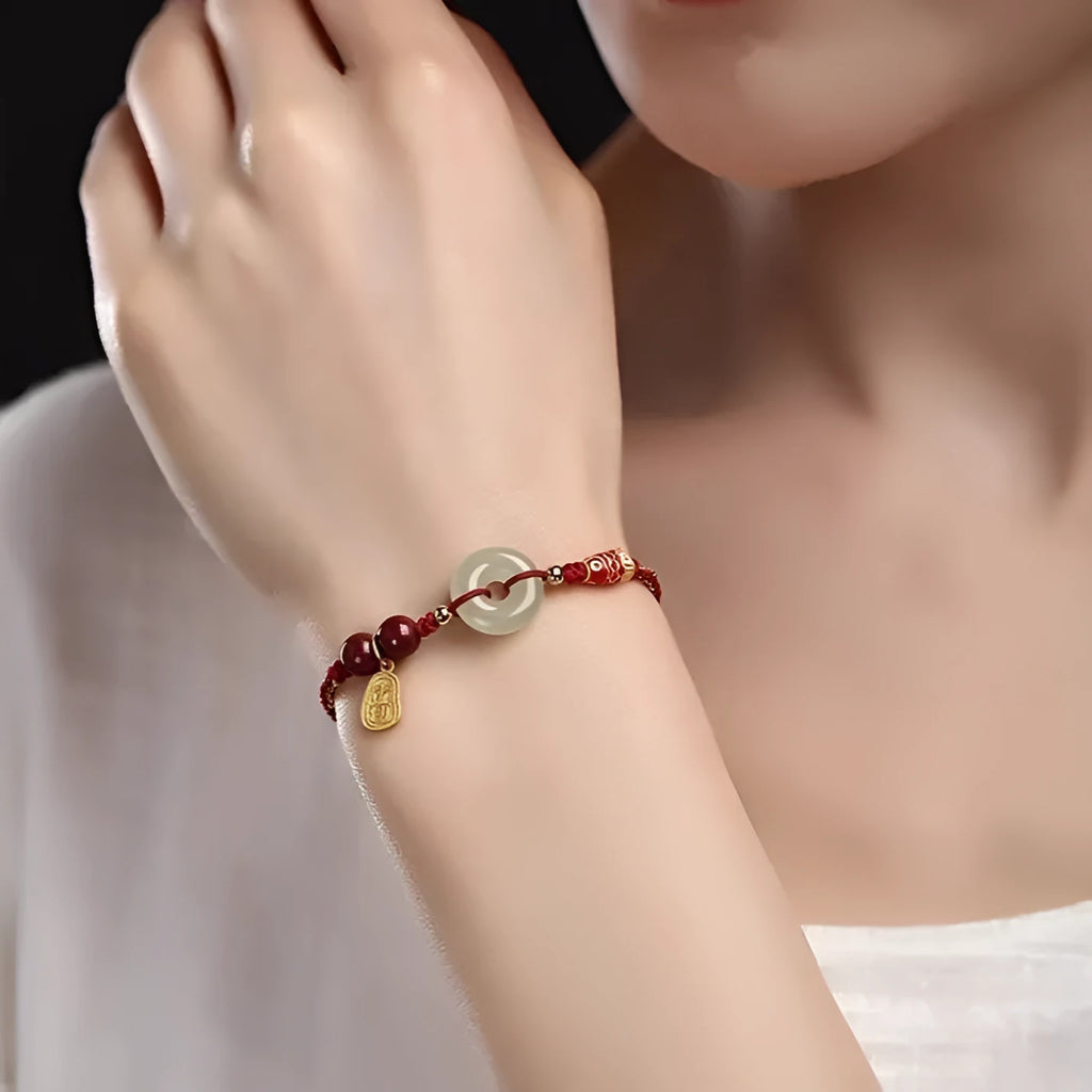 Hetian Jade peace buckle bracelet with koi fish charm on braided rope