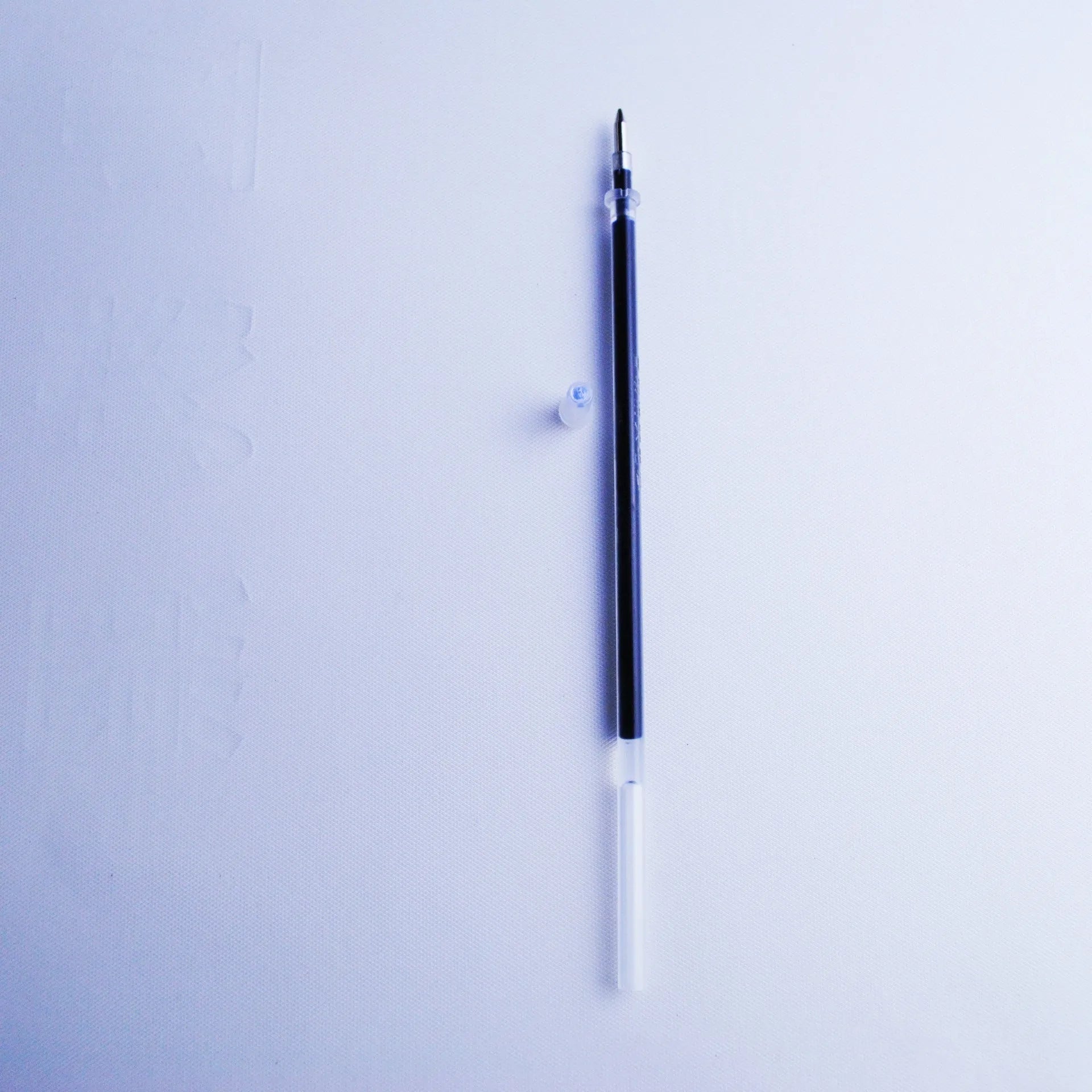 Portable fading ink pen set with 0.5mm tip, plastic body, and 8 refill cores