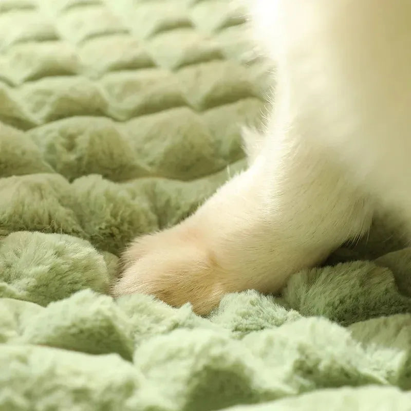 Large rectangular dog bed mat with a removable cover in a grey colour on a wooden floor.