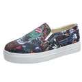 Women's low-top canvas slip-on sneaker in multiple colours, showing flat rubber sole and slip-on design.