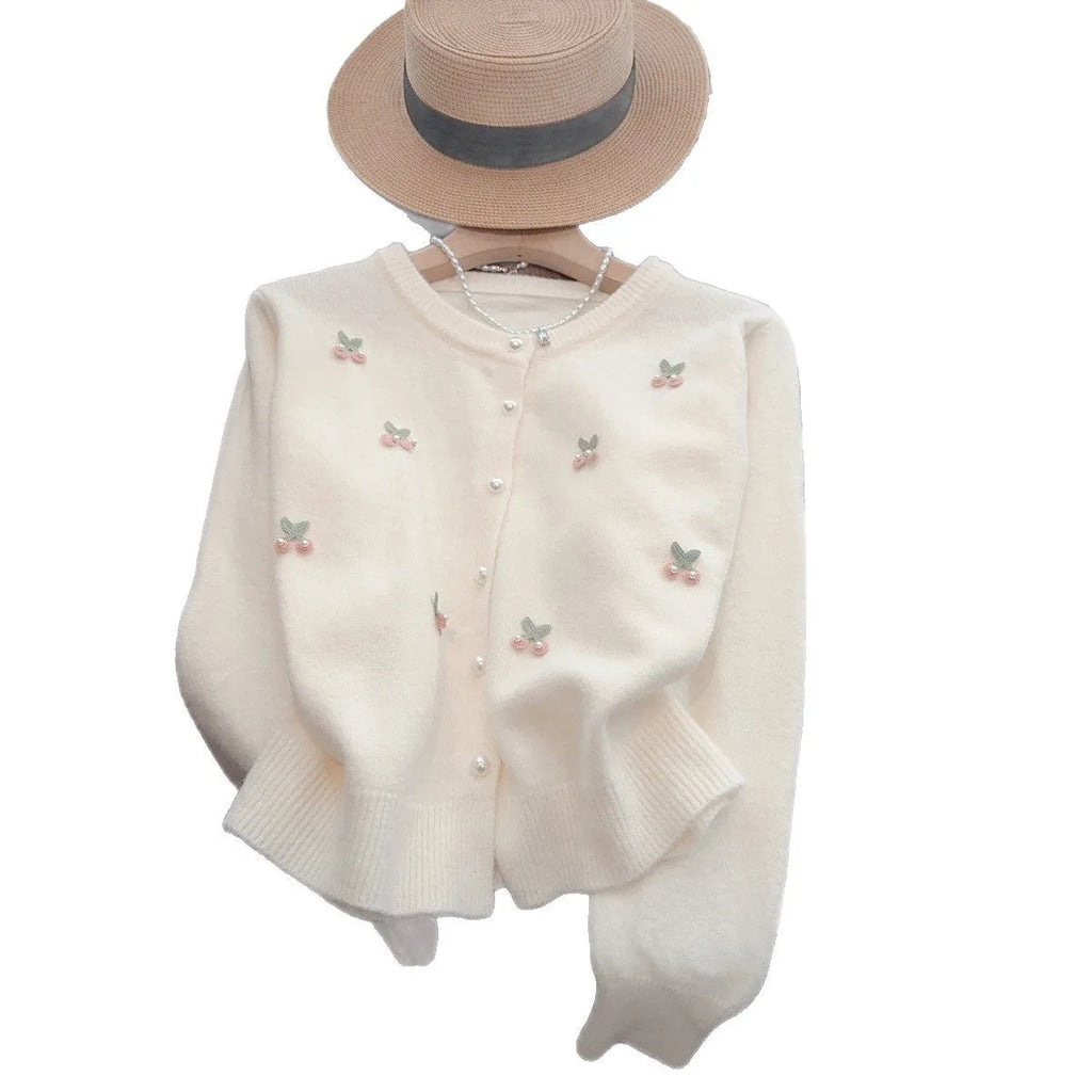 Pink cashmere blend cardigan with beaded detailing on the front, shown with a round neck and slim fit.