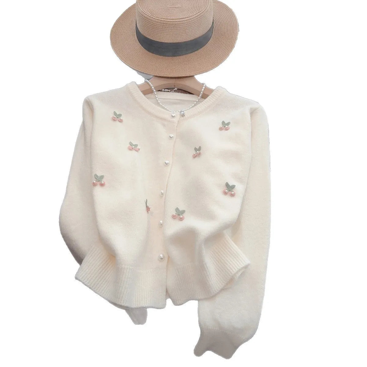 Pink cashmere blend cardigan with beaded detailing on the front, shown with a round neck and slim fit.