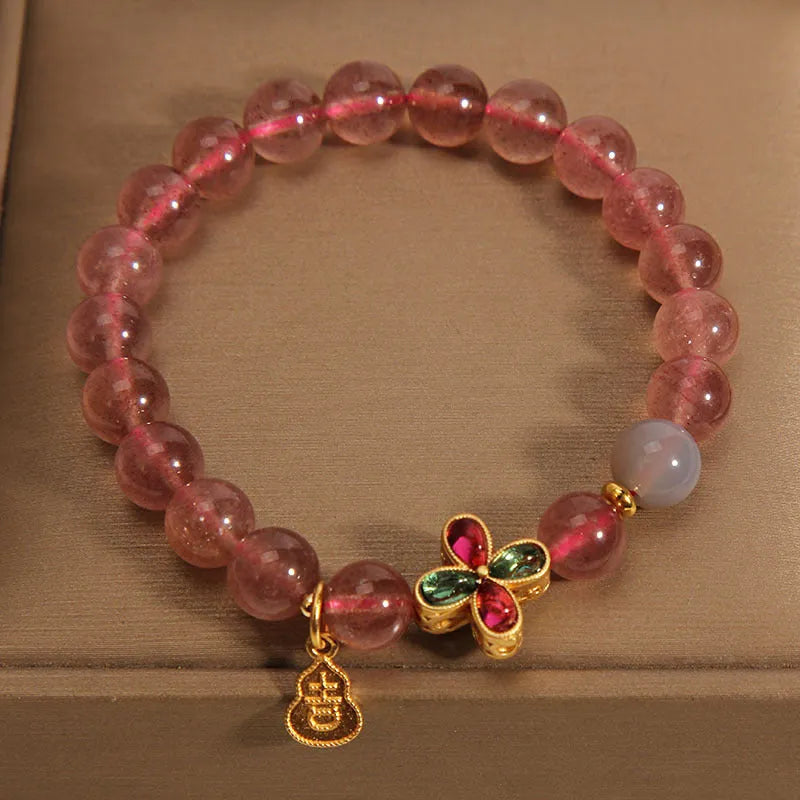 Natural strawberry quartz bracelet for women with four-leaf clover and calabash pendant on alloy chain with rhinestone accents
