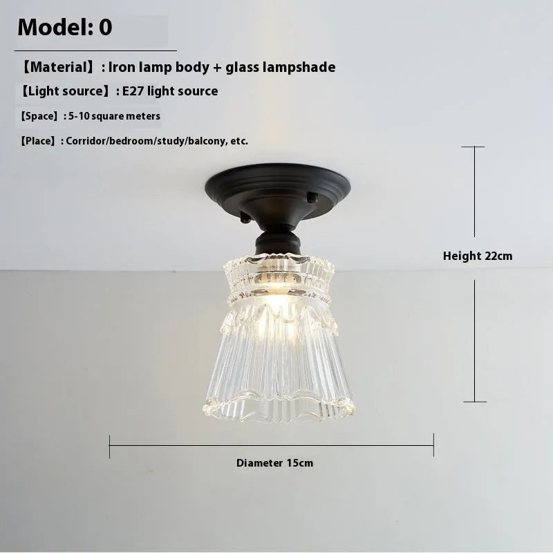 American retro style single-head ceiling or wall lamp with a glass cover.