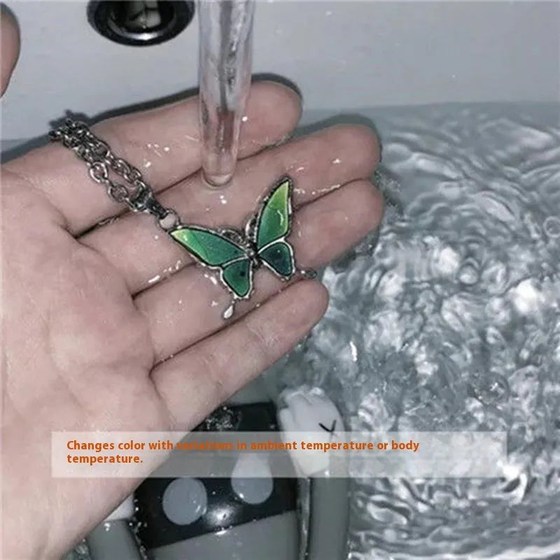 Retro colour-changing butterfly necklace on alloy O-ring chain, unisex design in butterfly cross chain style
