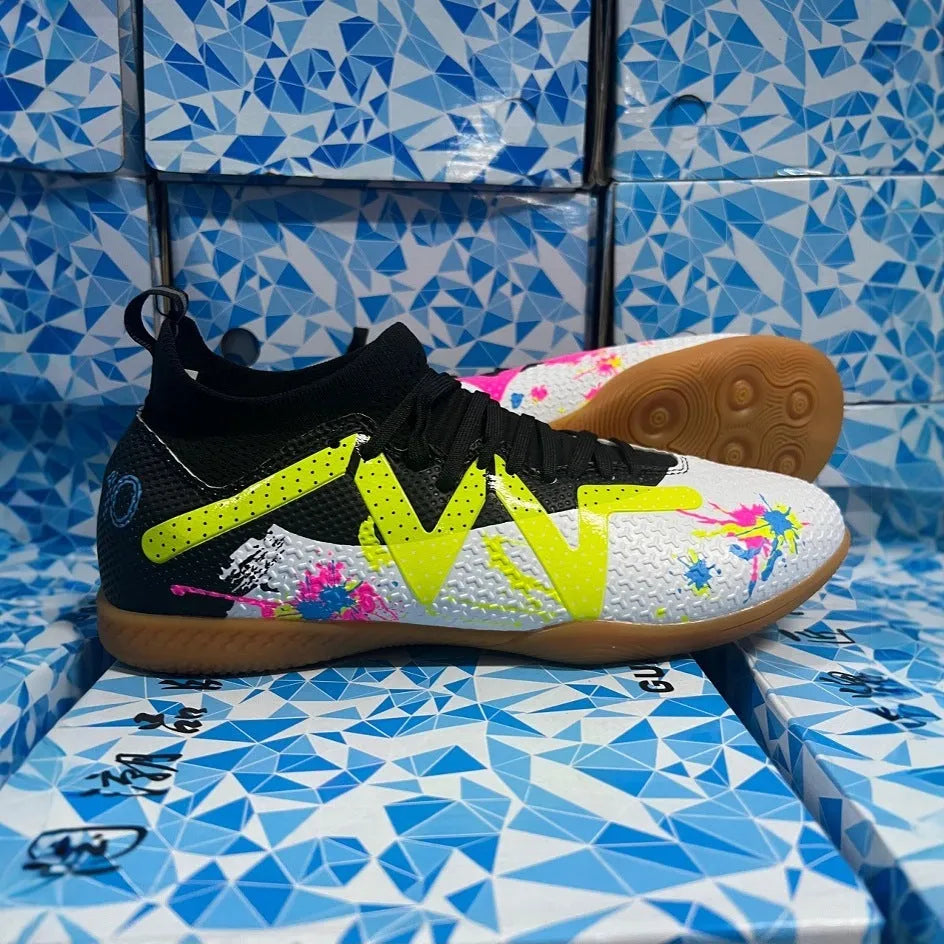 Low-top football boots with replaceable rubber studs on a non-slip sole, in Black and Yellow colourway.