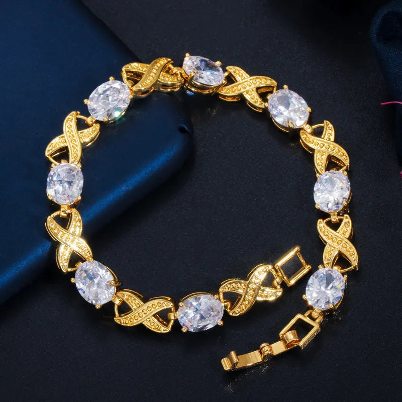 Women's gold plated copper zircon bracelet, 18cm with 3cm extender, in blue, green, red or white