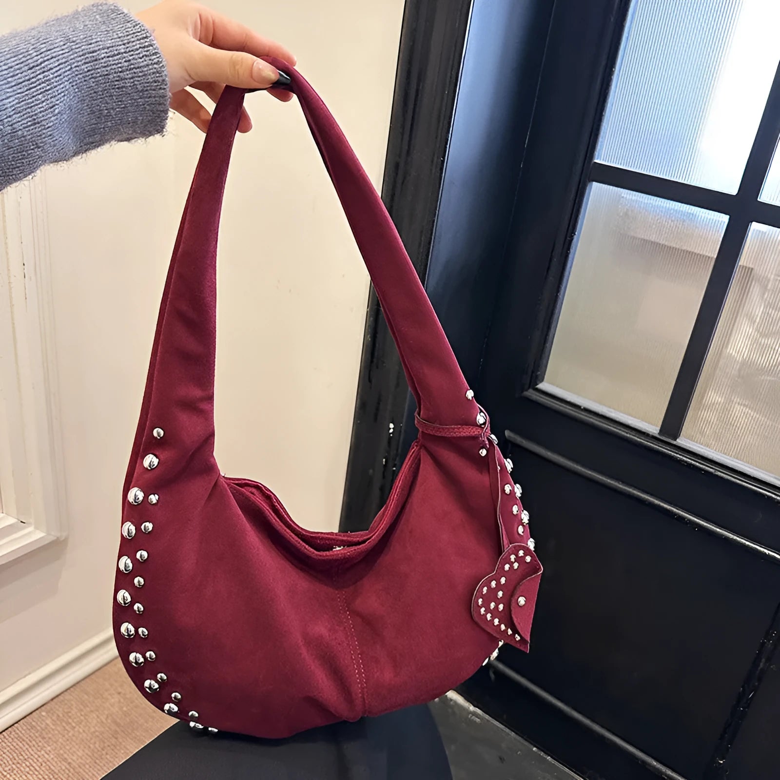 Soft plush retro tote handbag shown in black colour with strapless underarm carry design