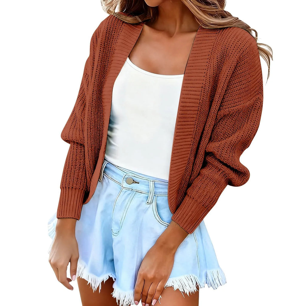 Women's short cape knitted cardigan sweater in solid colour, long sleeves, open front, polyester knit fabric.