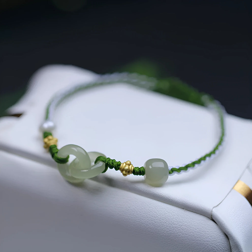 DIY woven bracelet with Hetian jade beads on a flexible wire band with silver or gold metal fittings.