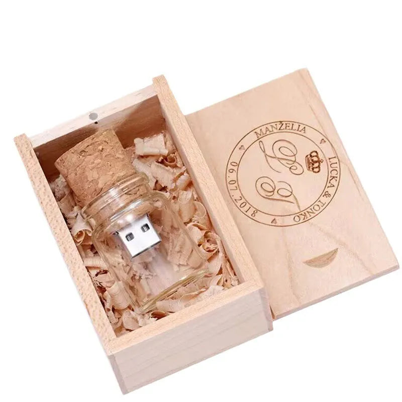 Wooden-lidded transparent glass bottle-shaped USB flash drive on a white background.