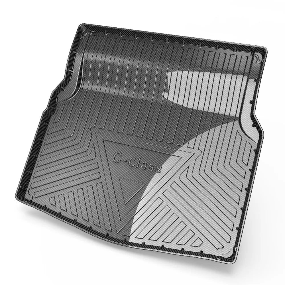 Black TPE car boot liner with carbon fibre pattern texture lying flat.
