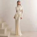 Women's slim fit long sleeve dress with high collar and pleated backless detail in apricot colour.