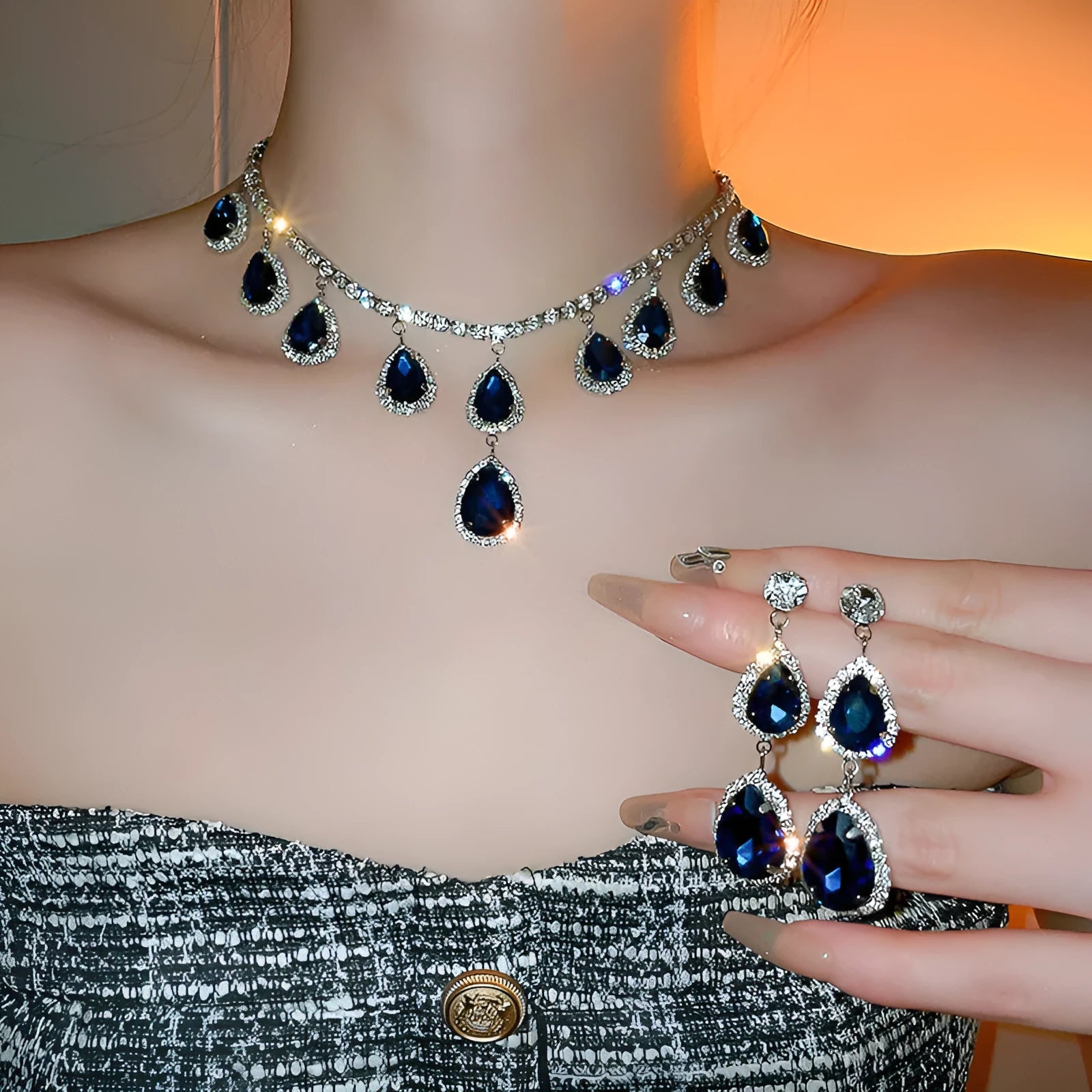 Silver needle water drop earrings and necklace set with blue zircon pendant on display