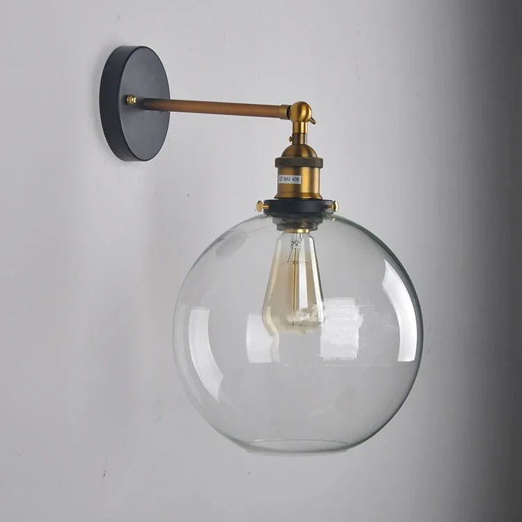 Round retro glass ball wall lamp in amber colour, 20cm diameter, with aluminium holder.