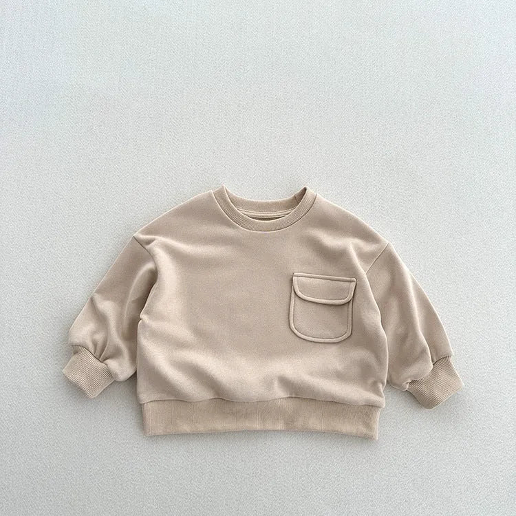 Solid colour cotton pullover for children with loose fit and pockets in Ivory White
