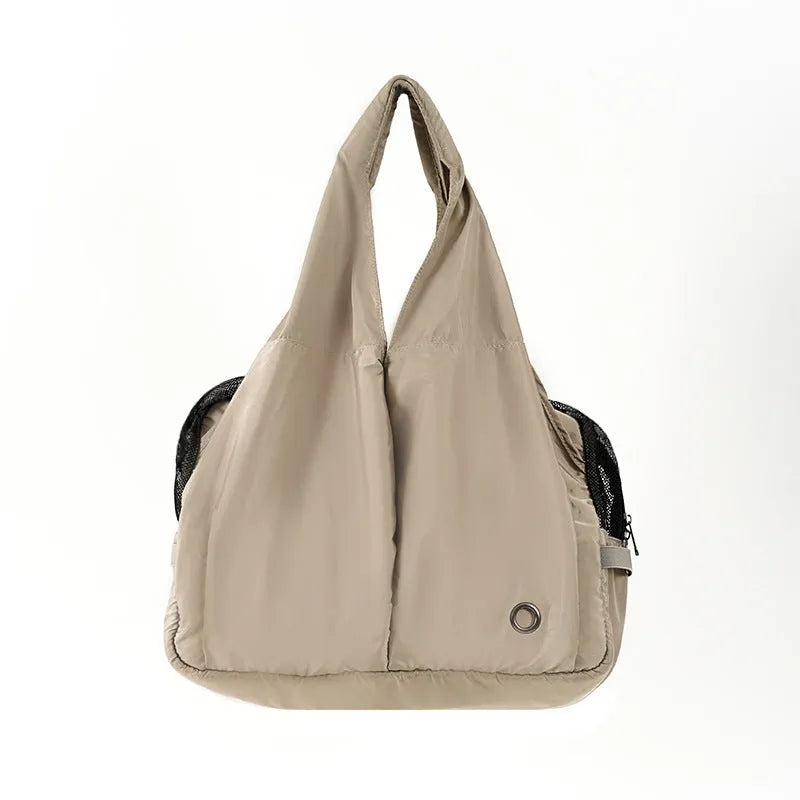 Apricot coloured cloth pet handbag with dimensions 41cm by 16cm by 28cm