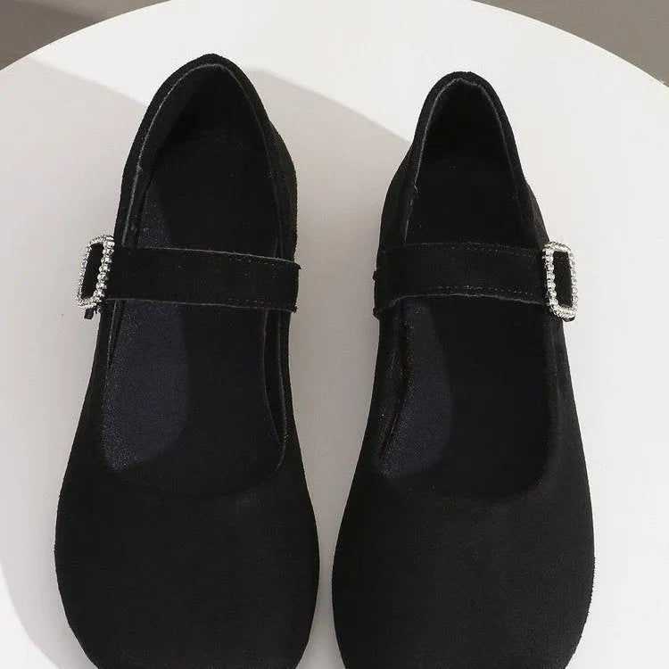 Black canvas fisherman shoes with low-top design and rubber soles