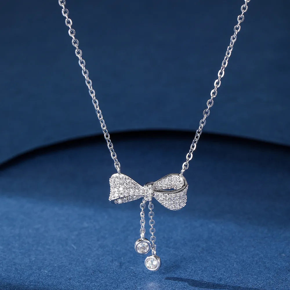 Sterling silver bow necklace with adjustable 40-45cm chain and O-ring design