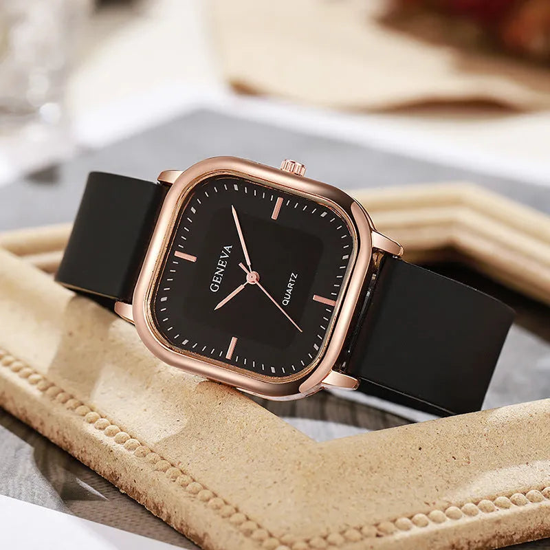 Women's rose gold square dial quartz watch with plastic strap on white background
