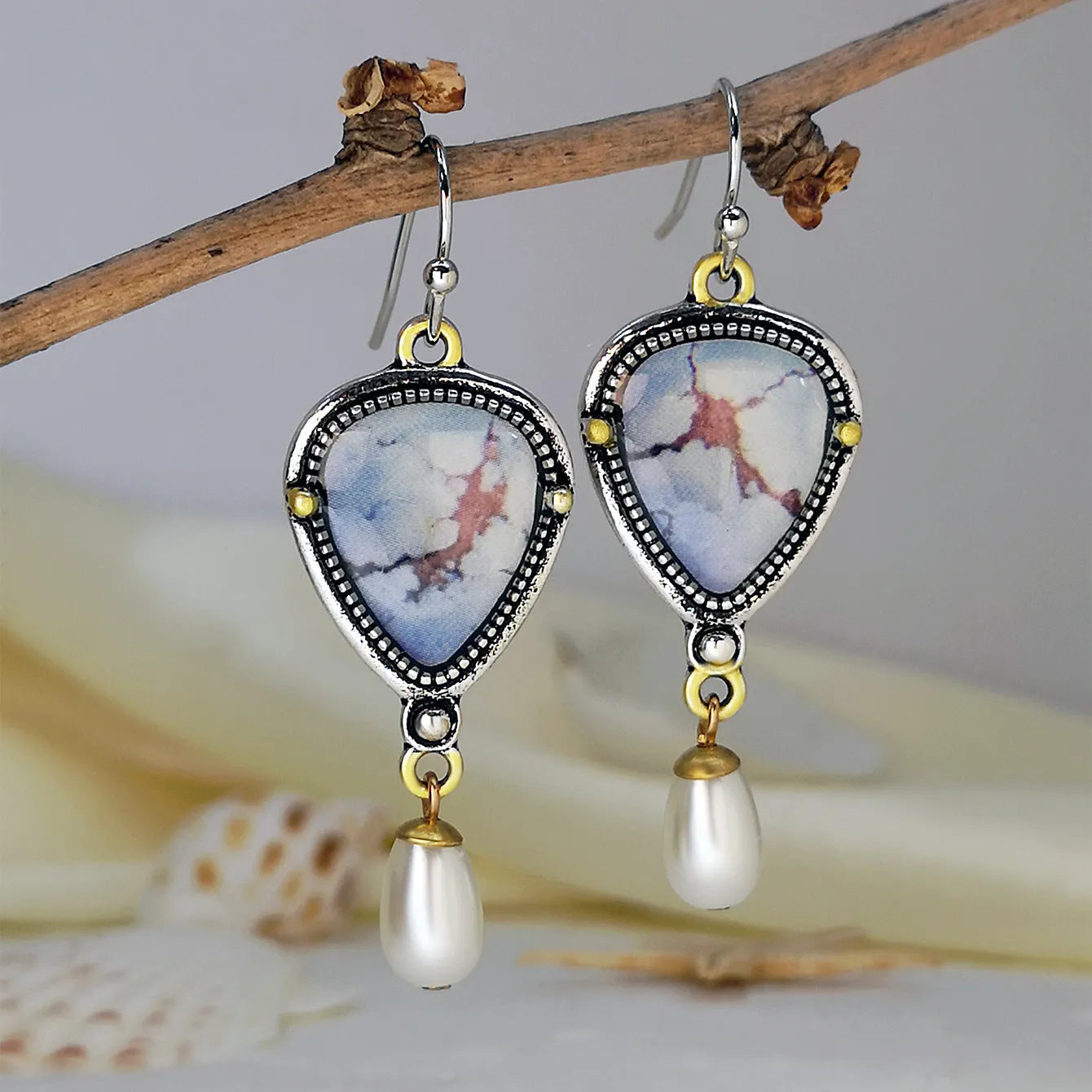 Retro blue geometric drop earrings with synthetic opal and pearl accents on electroplated metal