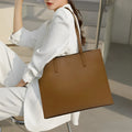 Genuine leather women's one shoulder handbag in a horizontal square shape showing internal compartments.