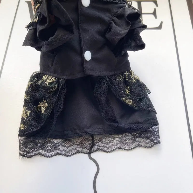 Golden gothic style skirt costume for a small dog or cat on a hanger.