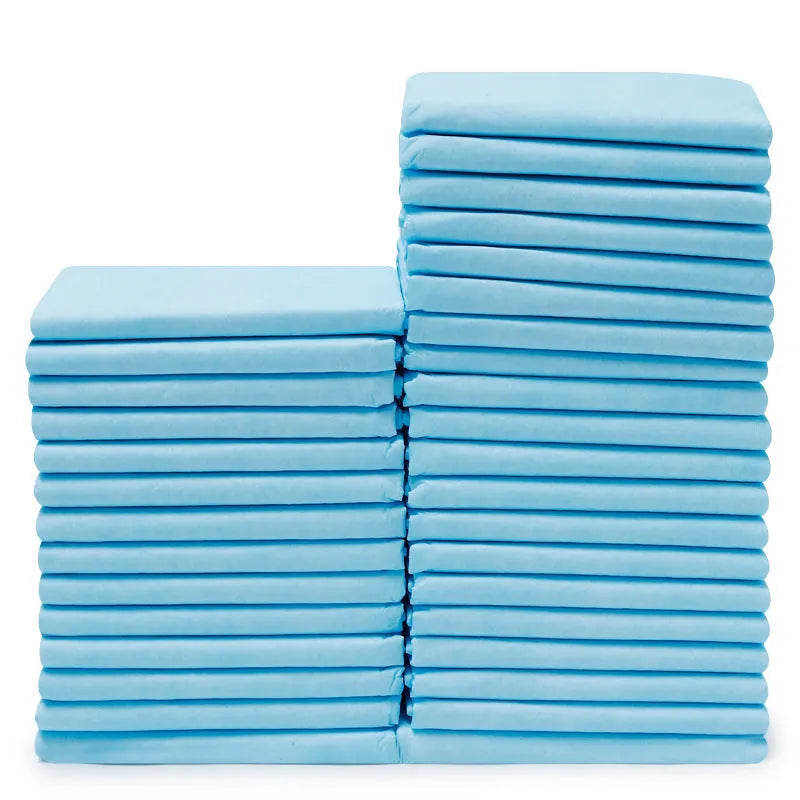 Disposable pet urinal pad for dogs with absorbent deodorant core in multiple sizes a pack of four pads on a floor
