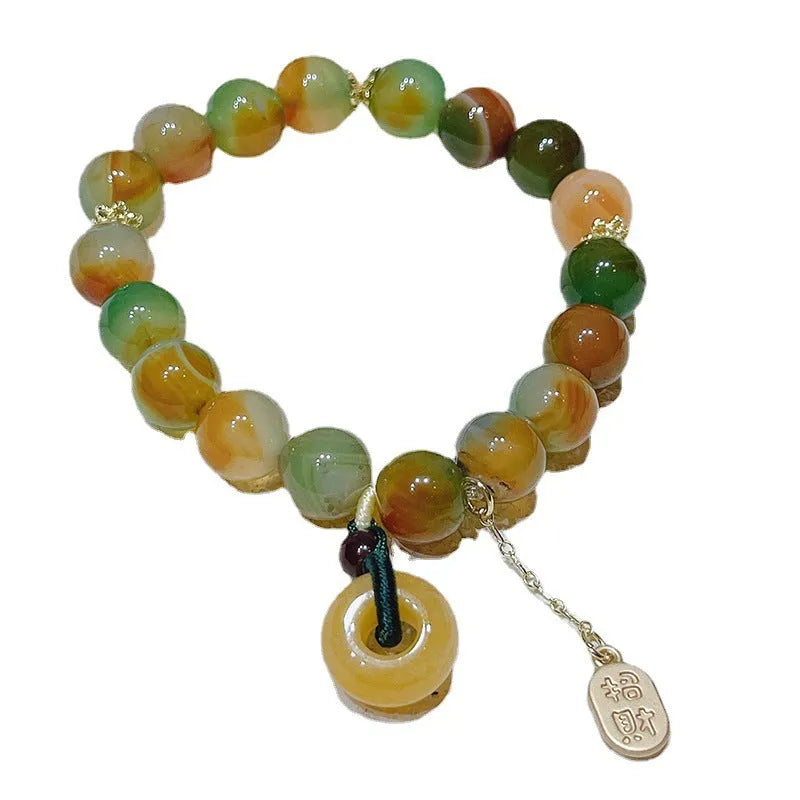 Yellow peacock agate bracelet with peace buckle clasp and old mine topaz stones
