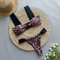 Women's leopard print bikini set with sleeveless tube top and matching swimsuit bottoms.