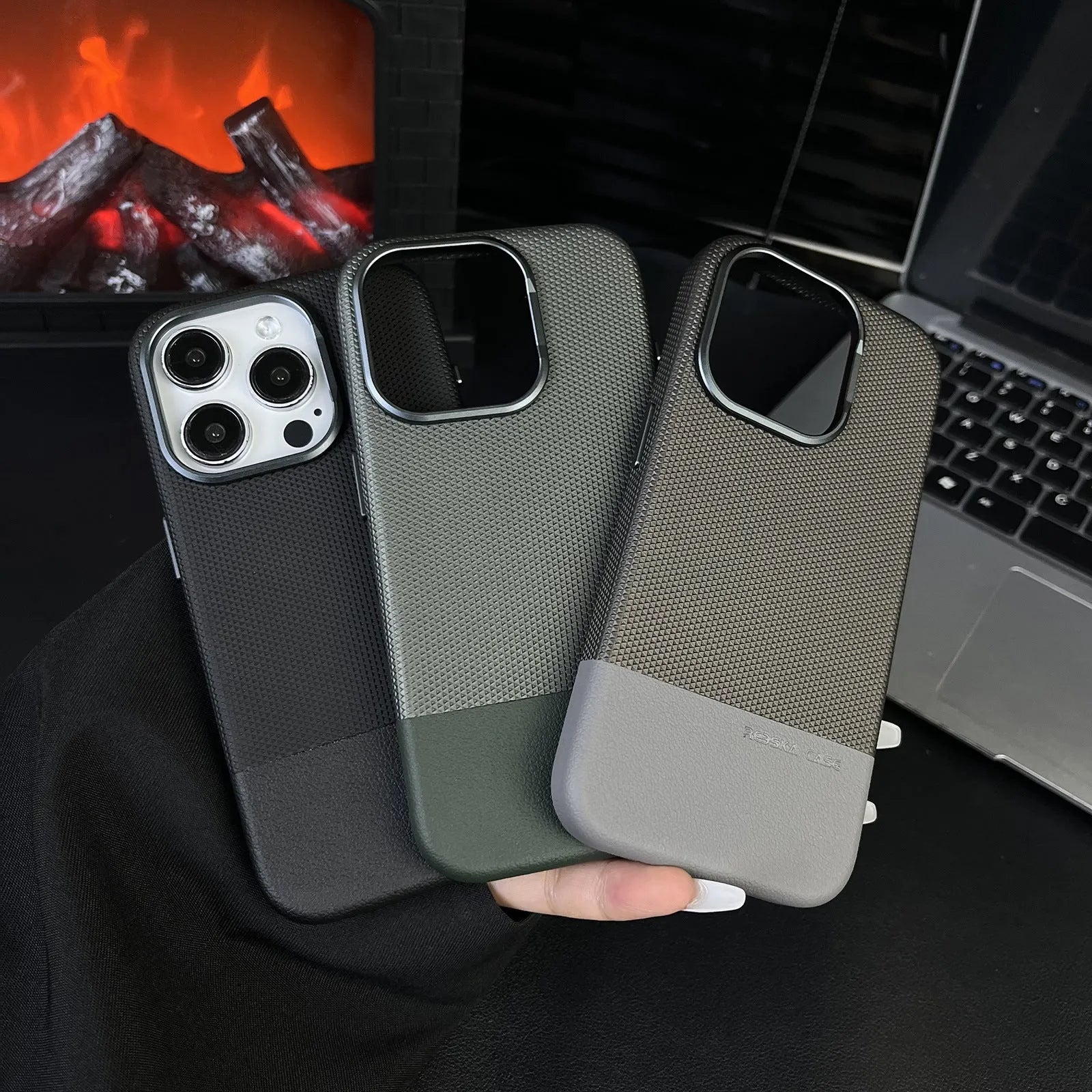 Black iPhone case with dragon scale texture and stitching design, showing magnetic ring on back.