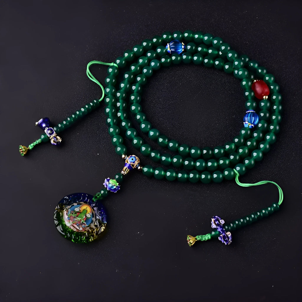 Natural green agate 108 bead bracelet with thangka pendant, worn as a multi-loop unisex accessory.