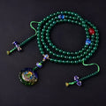 Natural green agate 108 bead bracelet with thangka pendant, worn as a multi-loop unisex accessory.