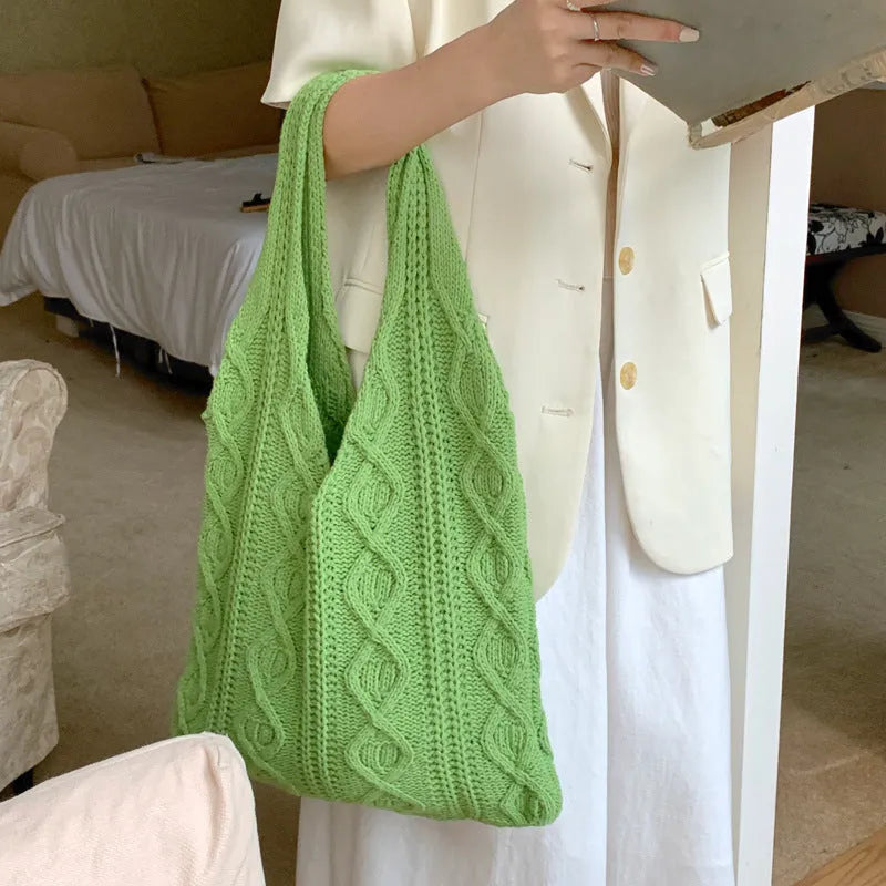 Retro hollow knitted wool yarn women's shoulder tote bag in a solid colour with double straps.