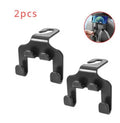 Two white ABS plastic car hooks for mounting phones and organising items in vehicles.
