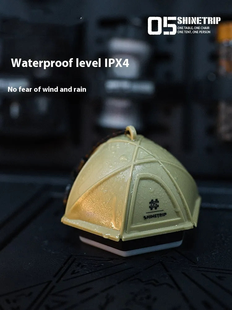 Analog adjustable camping tent light in dark green colour showing brightness control dial