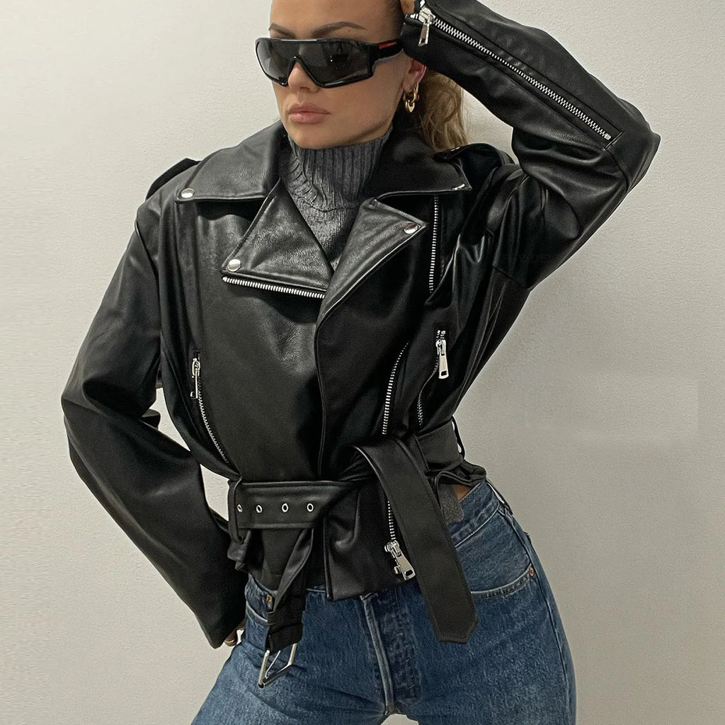 Black punk locomotive style leather jacket with a short belt lapel and Peter Pan collar.